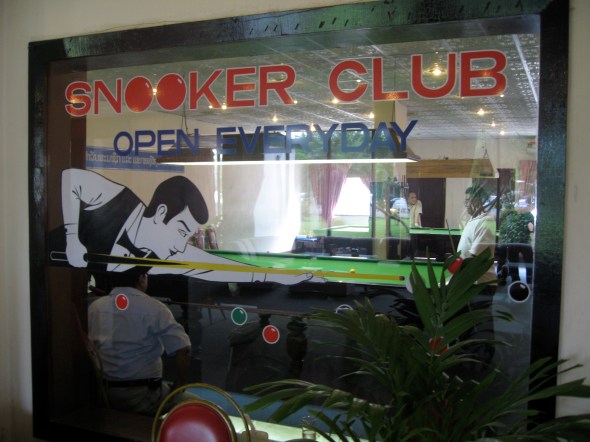 A billiards hall in the Lane Xang Hotel in Vientiene, Laos. Photography by Roy Hamric